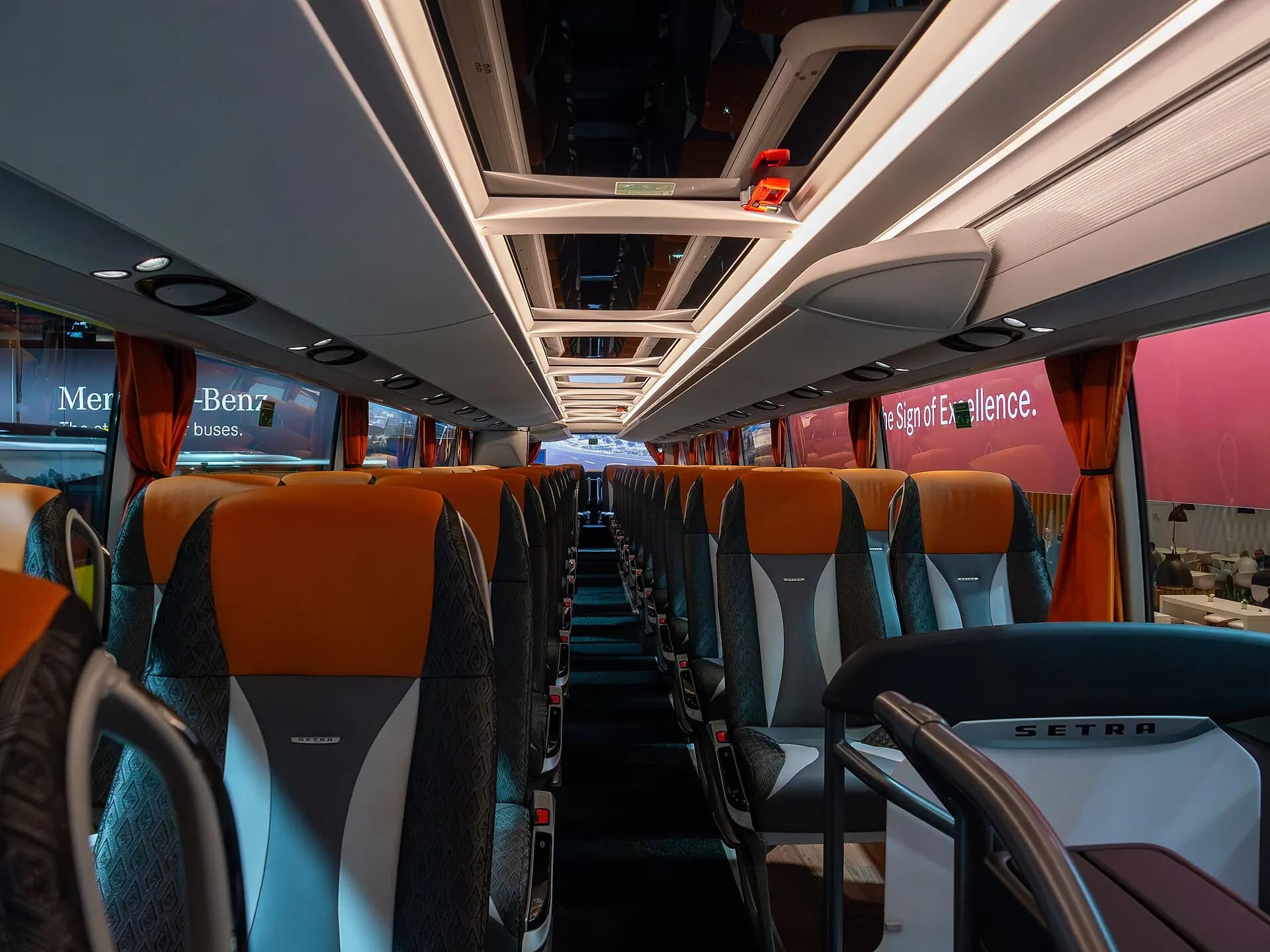 Modern full-size motor coach passenger interior.