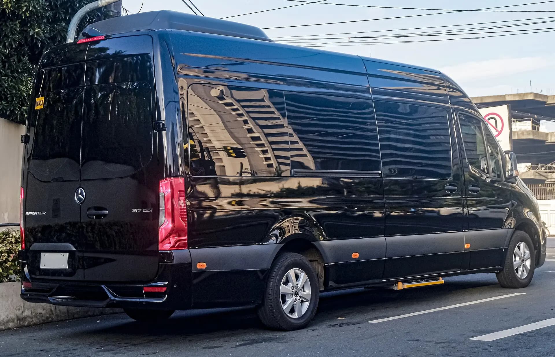 Alternate exterior view of a black premium Mercedes-Benz Sprinter.