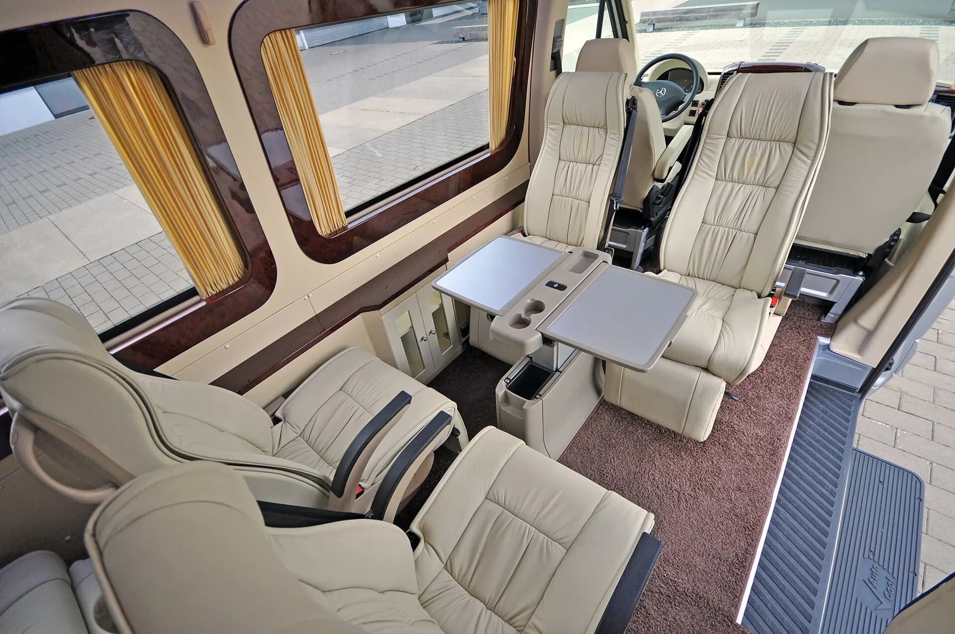 Executive Sprinter interior with premium individual passenger seats.